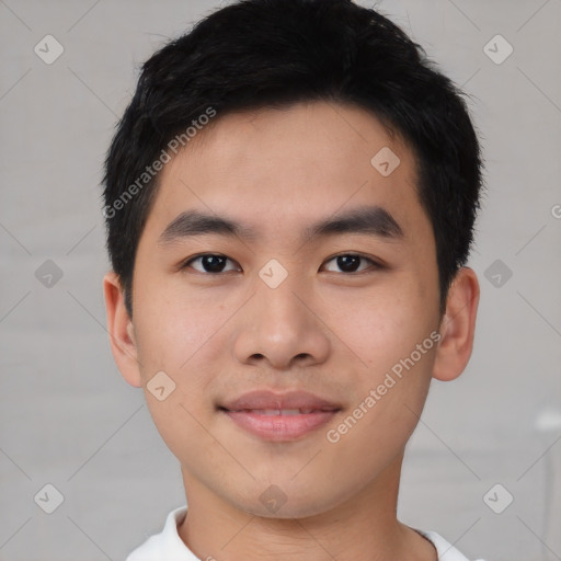 Joyful asian young-adult male with short  black hair and brown eyes