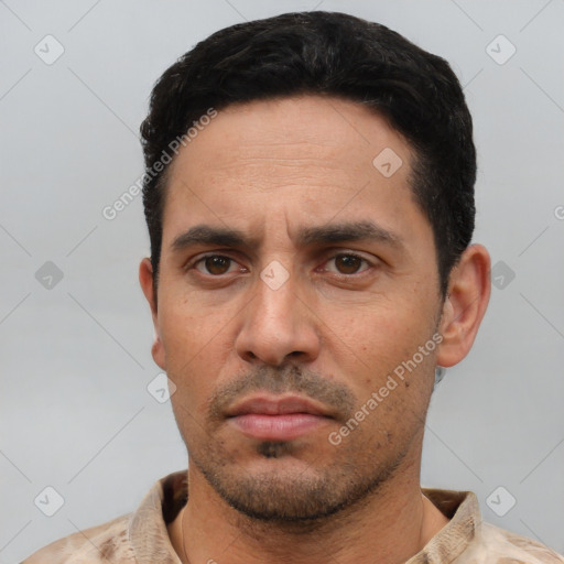 Neutral white young-adult male with short  black hair and brown eyes