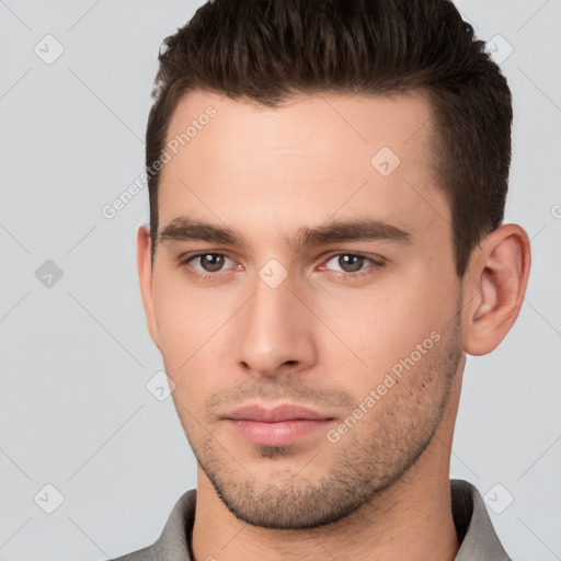 Neutral white young-adult male with short  brown hair and brown eyes