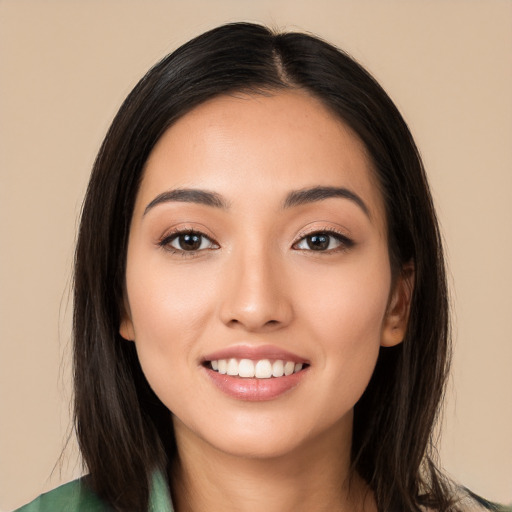 Joyful white young-adult female with long  black hair and brown eyes