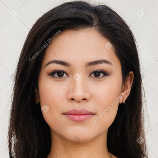 Joyful latino young-adult female with long  brown hair and brown eyes