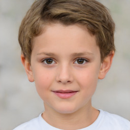 Joyful white child male with short  brown hair and brown eyes