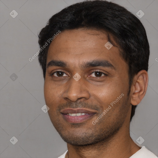 Joyful black young-adult male with short  black hair and brown eyes