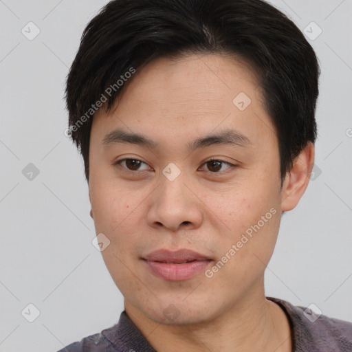 Joyful asian young-adult male with short  brown hair and brown eyes