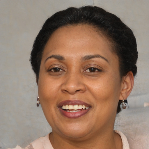 Joyful asian adult female with short  brown hair and brown eyes