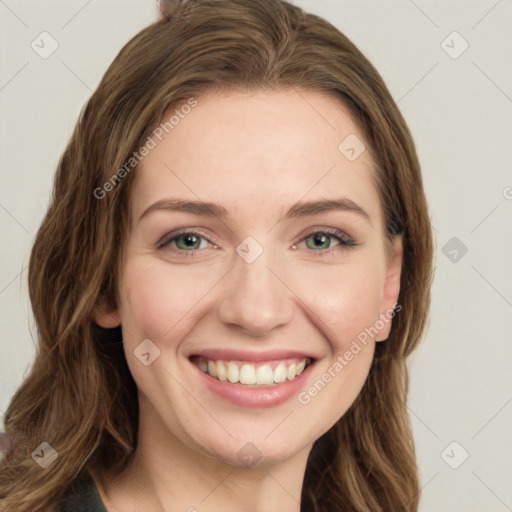 Joyful white young-adult female with long  brown hair and green eyes