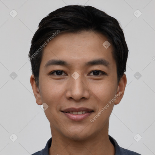 Joyful white young-adult male with short  black hair and brown eyes