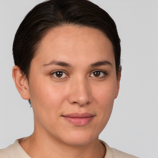 Joyful white young-adult female with short  brown hair and brown eyes