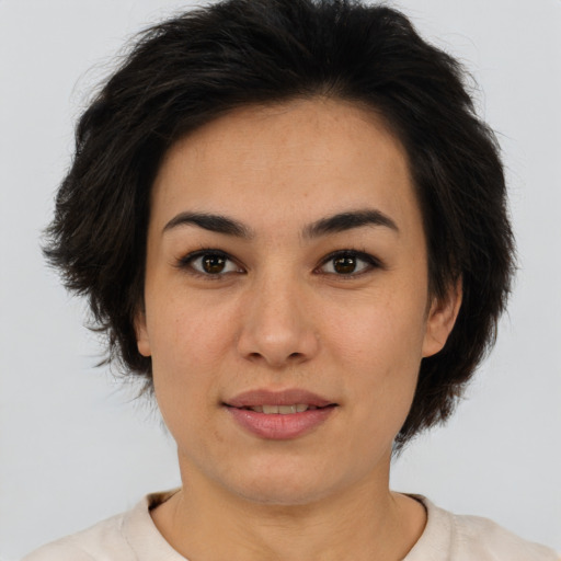 Joyful asian young-adult female with short  brown hair and brown eyes