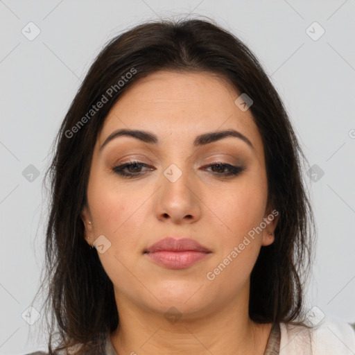 Joyful latino young-adult female with medium  brown hair and brown eyes