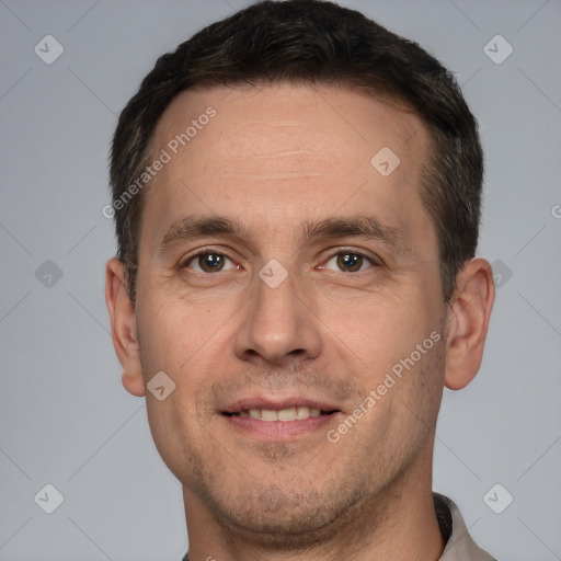 Joyful white adult male with short  brown hair and brown eyes