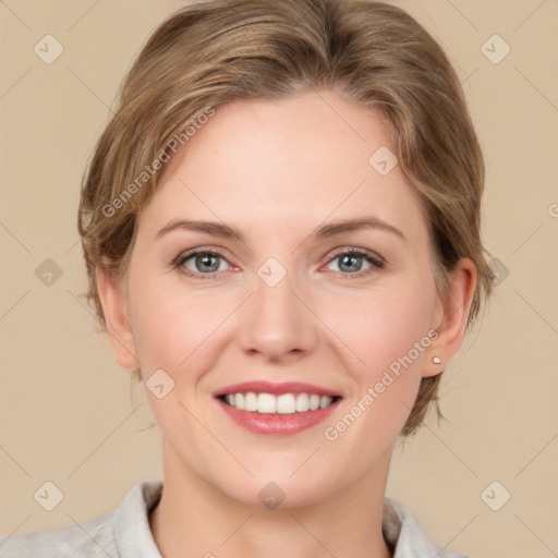 Joyful white young-adult female with medium  brown hair and grey eyes