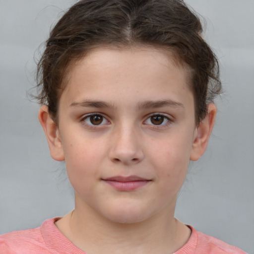 Joyful white child female with short  brown hair and brown eyes