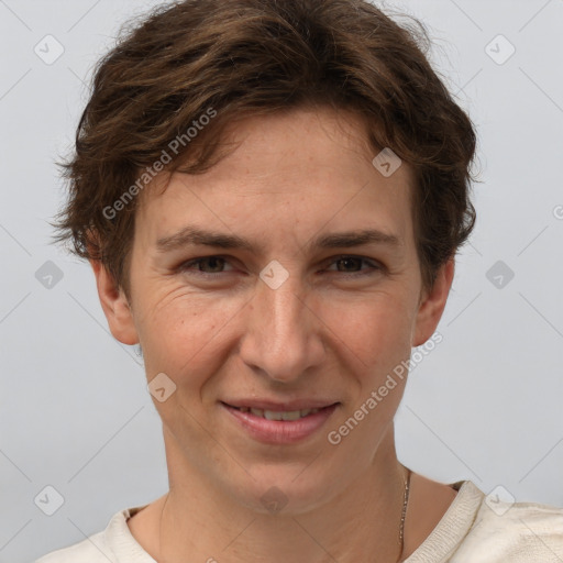 Joyful white adult female with short  brown hair and grey eyes