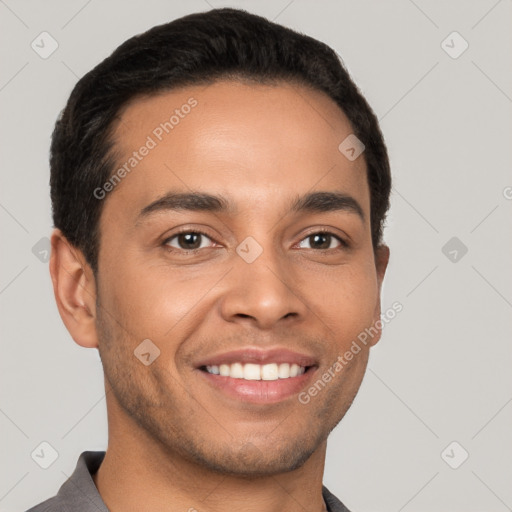 Joyful latino young-adult male with short  brown hair and brown eyes