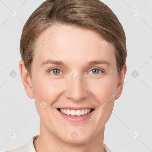 Joyful white young-adult female with short  brown hair and grey eyes