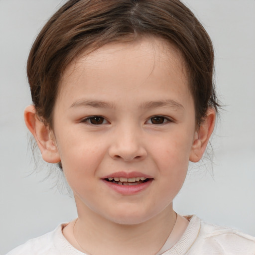 Joyful white child female with short  brown hair and brown eyes