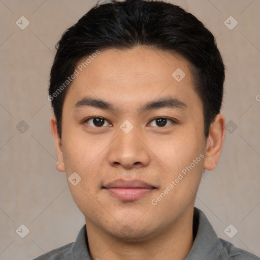 Joyful asian young-adult male with short  brown hair and brown eyes