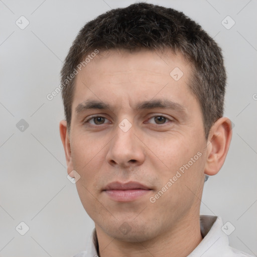 Neutral white young-adult male with short  brown hair and brown eyes