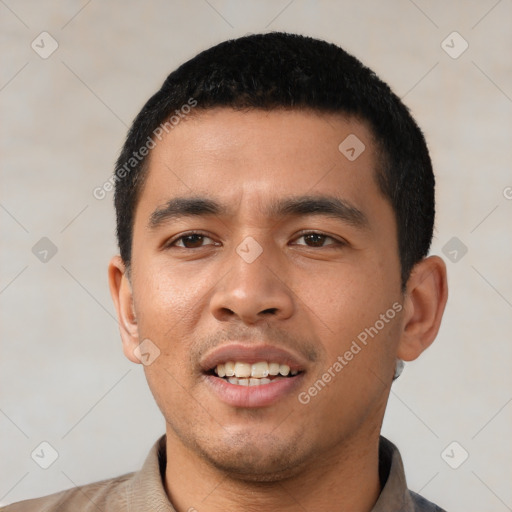 Joyful latino young-adult male with short  black hair and brown eyes