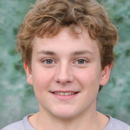 Joyful white child male with short  brown hair and grey eyes