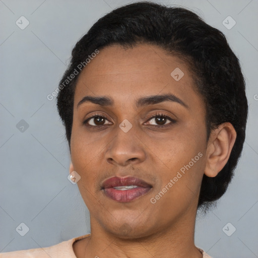 Joyful latino young-adult female with short  black hair and brown eyes