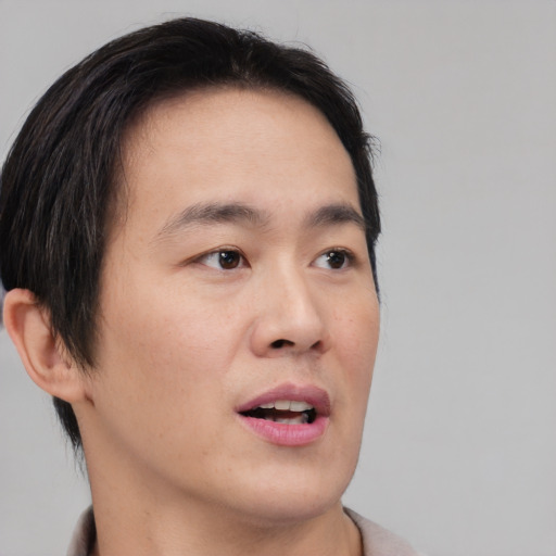 Neutral asian young-adult male with short  brown hair and brown eyes
