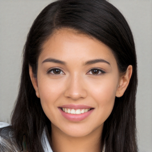 Joyful white young-adult female with long  brown hair and brown eyes