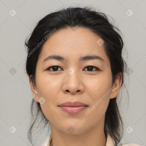 Joyful asian young-adult female with medium  brown hair and brown eyes