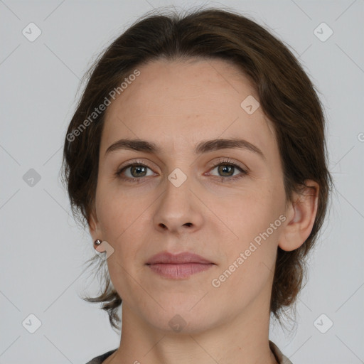 Neutral white young-adult female with medium  brown hair and grey eyes