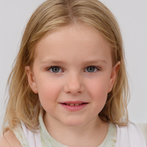 Joyful white child female with medium  brown hair and blue eyes