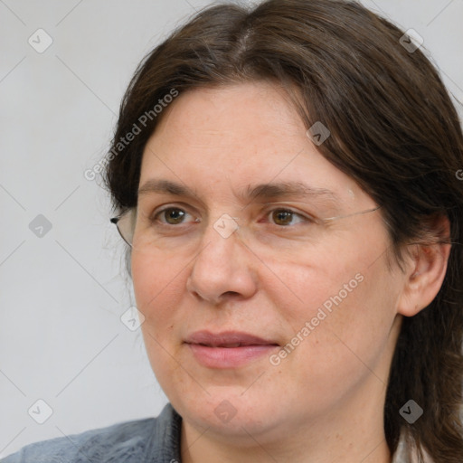 Joyful white adult female with medium  brown hair and brown eyes