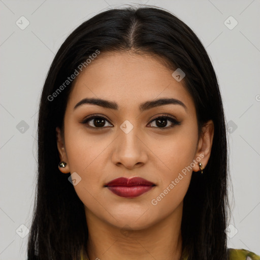 Joyful latino young-adult female with long  brown hair and brown eyes