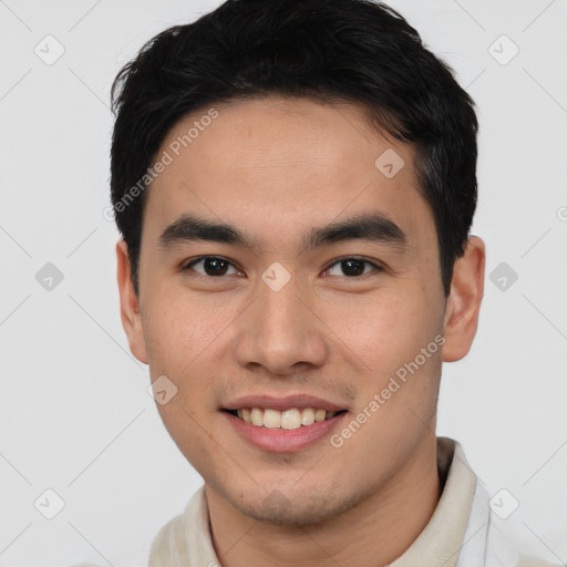 Joyful asian young-adult male with short  brown hair and brown eyes