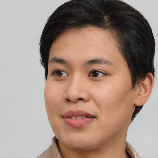 Joyful asian young-adult female with medium  brown hair and brown eyes