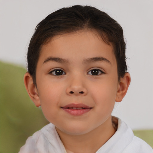 Joyful white child female with short  brown hair and brown eyes