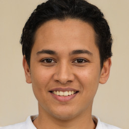 Joyful latino young-adult male with short  brown hair and brown eyes