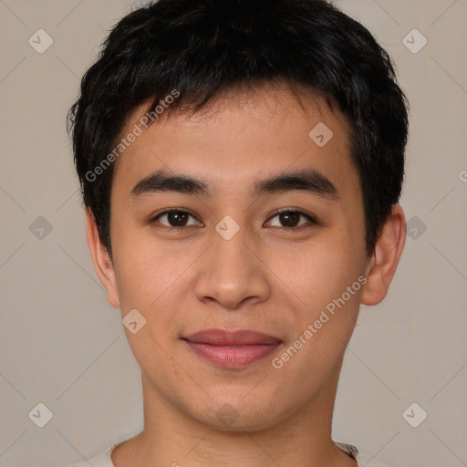 Joyful asian young-adult male with short  brown hair and brown eyes