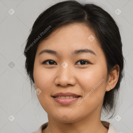 Joyful asian young-adult female with medium  brown hair and brown eyes