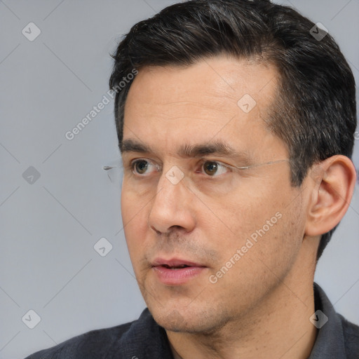 Neutral white adult male with short  black hair and brown eyes