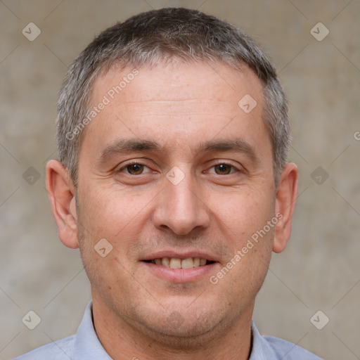 Joyful white adult male with short  brown hair and brown eyes