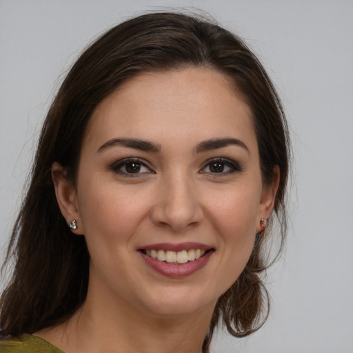 Joyful white young-adult female with medium  brown hair and brown eyes