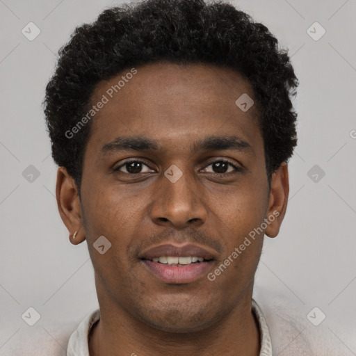 Joyful black young-adult male with short  brown hair and brown eyes