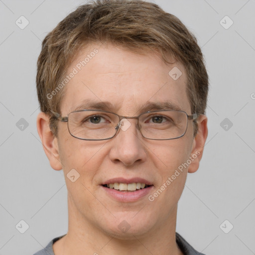 Joyful white adult male with short  brown hair and grey eyes