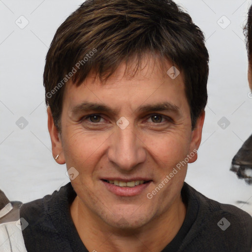 Joyful white adult male with short  brown hair and brown eyes