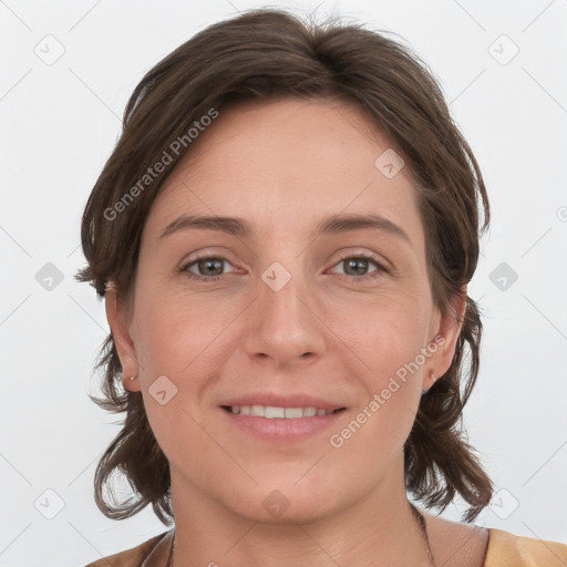 Joyful white young-adult female with medium  brown hair and grey eyes