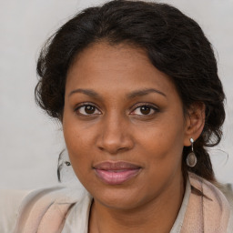 Joyful black young-adult female with medium  brown hair and brown eyes