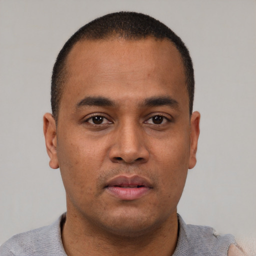 Neutral latino young-adult male with short  brown hair and brown eyes