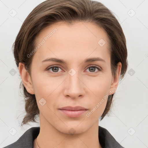 Joyful white young-adult female with medium  brown hair and grey eyes