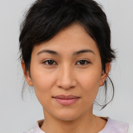 Joyful asian young-adult female with medium  brown hair and brown eyes